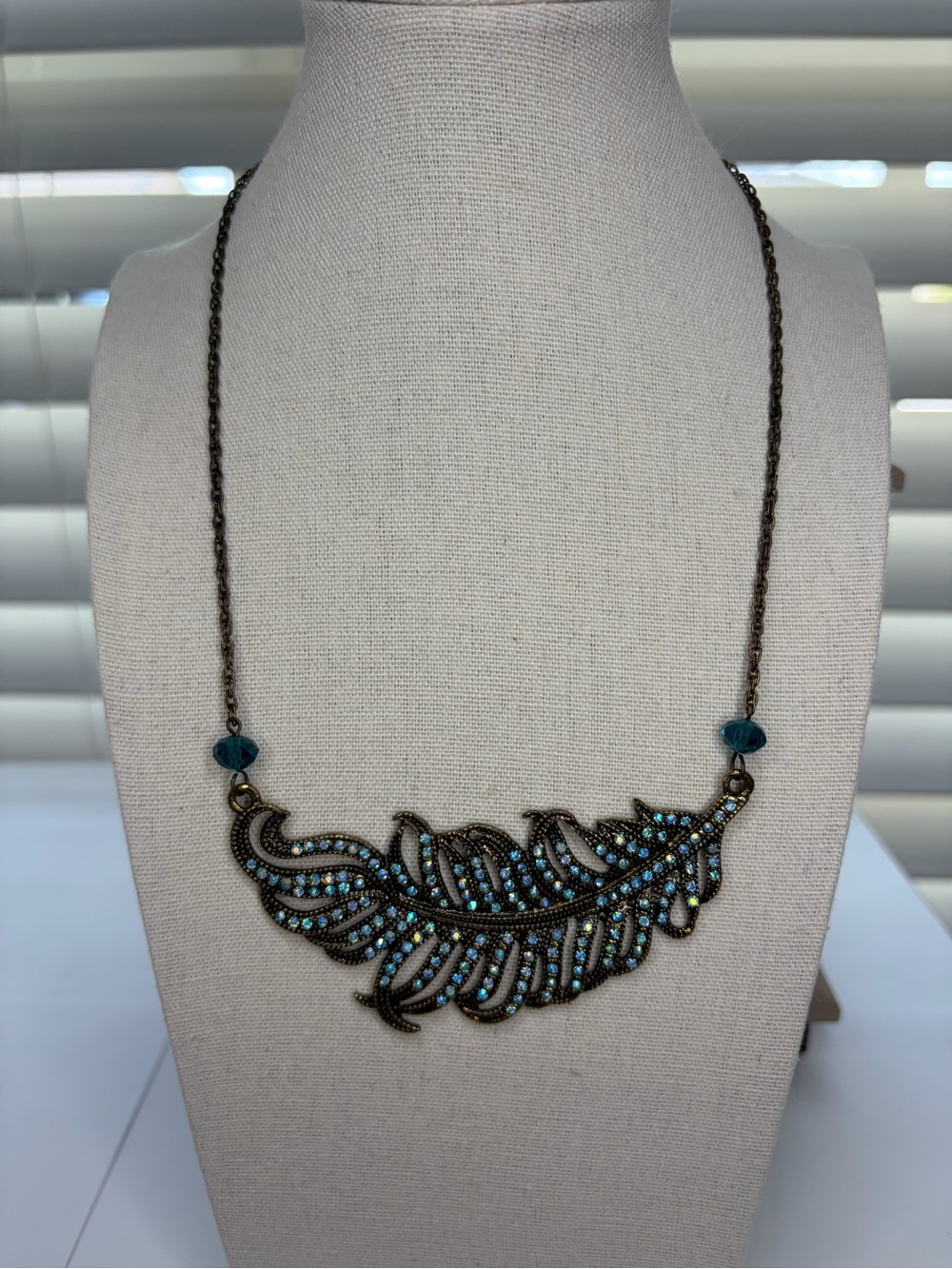 Bronze Feather Necklace with Teal Crystal Accents